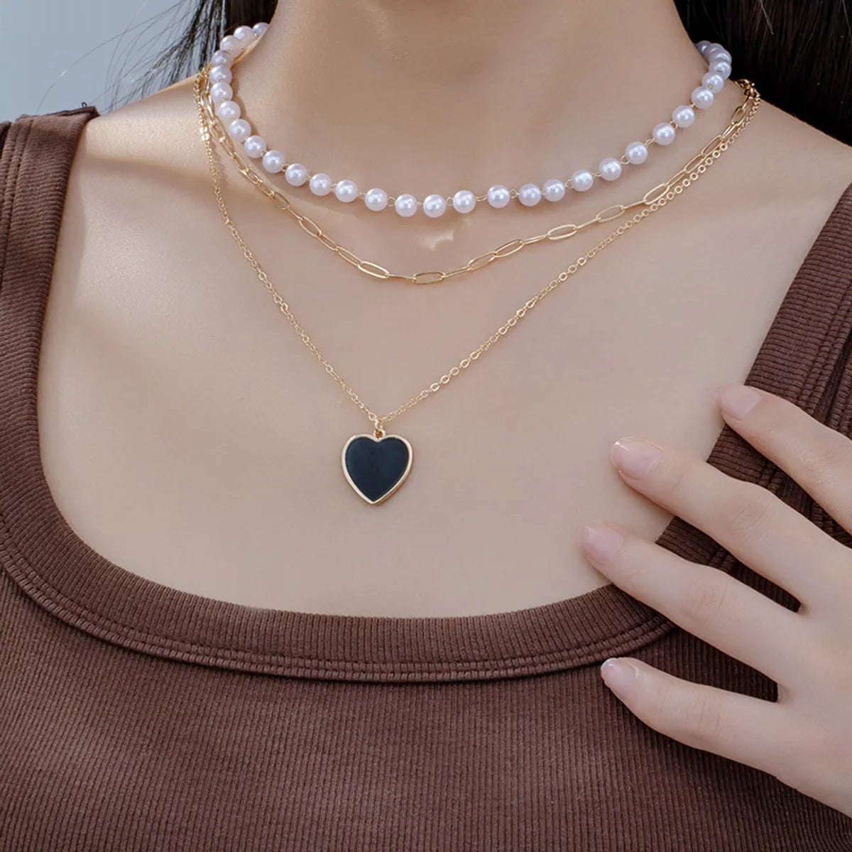 Necklaces With Heart Shapes-Simple Style Heart Shape Plastic Zinc Alloy Women's Three Layer Necklace