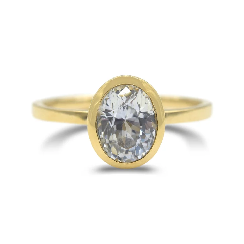 Silent Rings For Subtlety-Ethereal white sapphire bezel set ring in 14k yellow gold