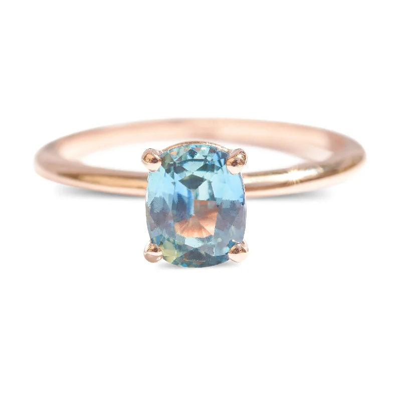 Most Enduring Rings-Cushion cut teal sapphire engagement ring in rose gold